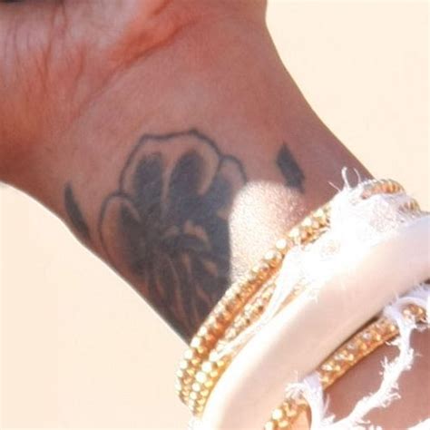 Kelis Latin Wrist Tattoo